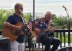 The sun finally managed to appear for Jack and old friend Don who played on the back porch at Bourbon Street on Sunday. photo by BB Huey